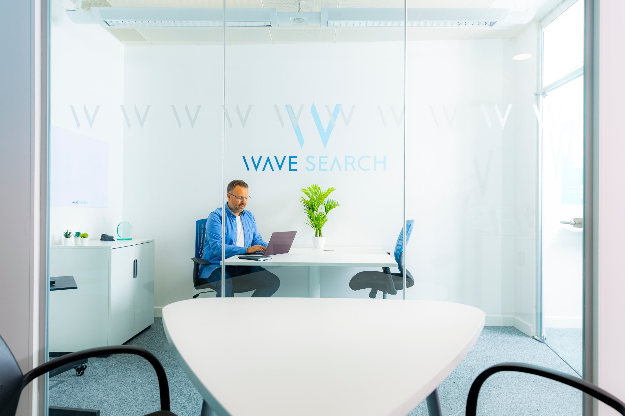 A Wave Search Talent Director at work in the office
